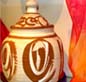 Burial urn and prayer shawl
