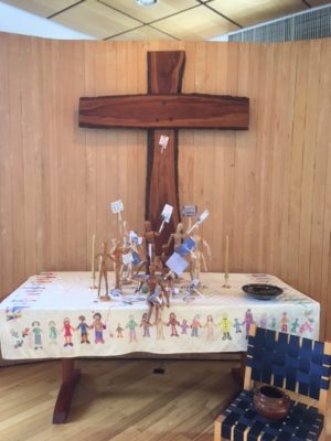 2017 Easter altar with articulated mannikins holding signs