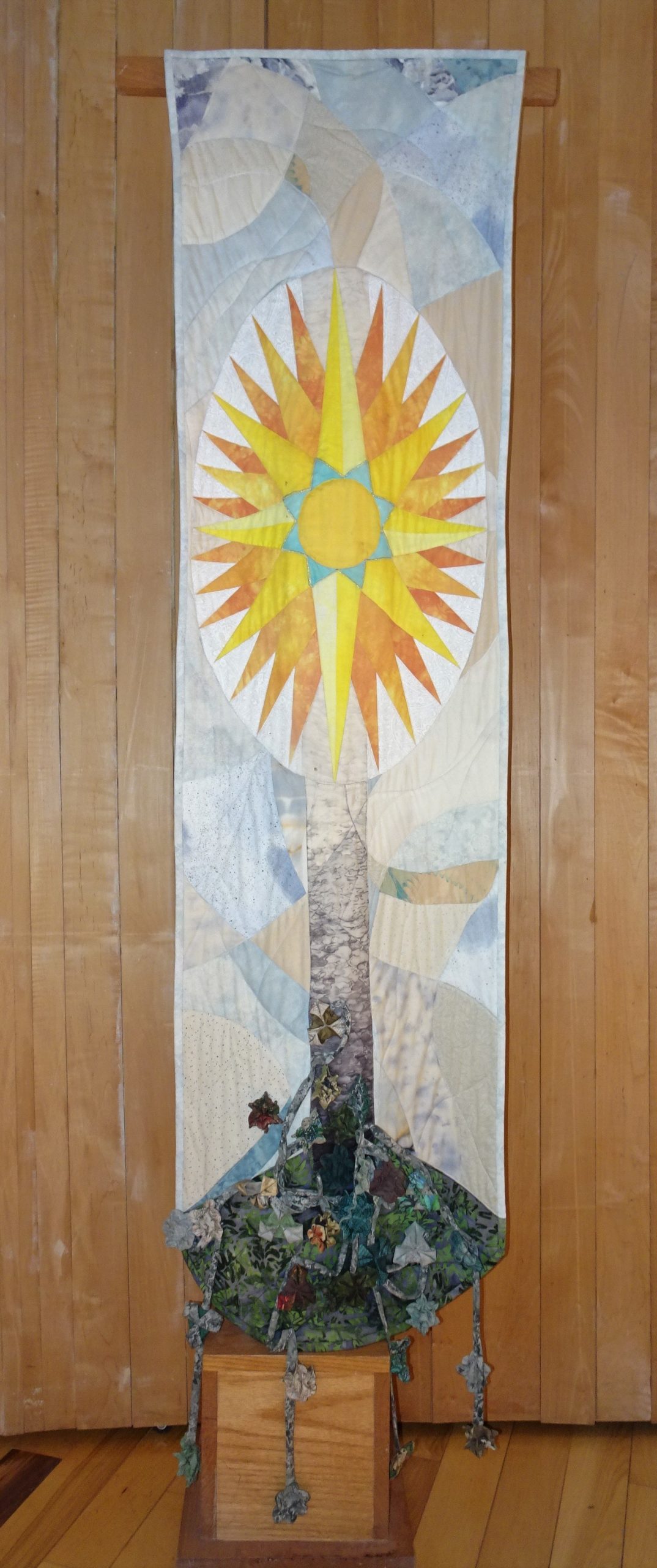 Banner with image of cross, compass rose, and the Seekers plant