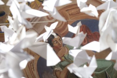 Paper doves symbolizing peace hang from the ceiling under a mural at the Church of the Most Holy Apostles Peter and Paul in Lviv. Mass is held at the Church of the Most Holy Apostles Peter and Paul. Days earlier, the funeral of three Ukrainian soldiers killed during the combat took place. Thirty
kilometers away, Russian missiles struck a military base killing 35 soldiers. 
Credit: SOPA Images Limited/Alamy Live News